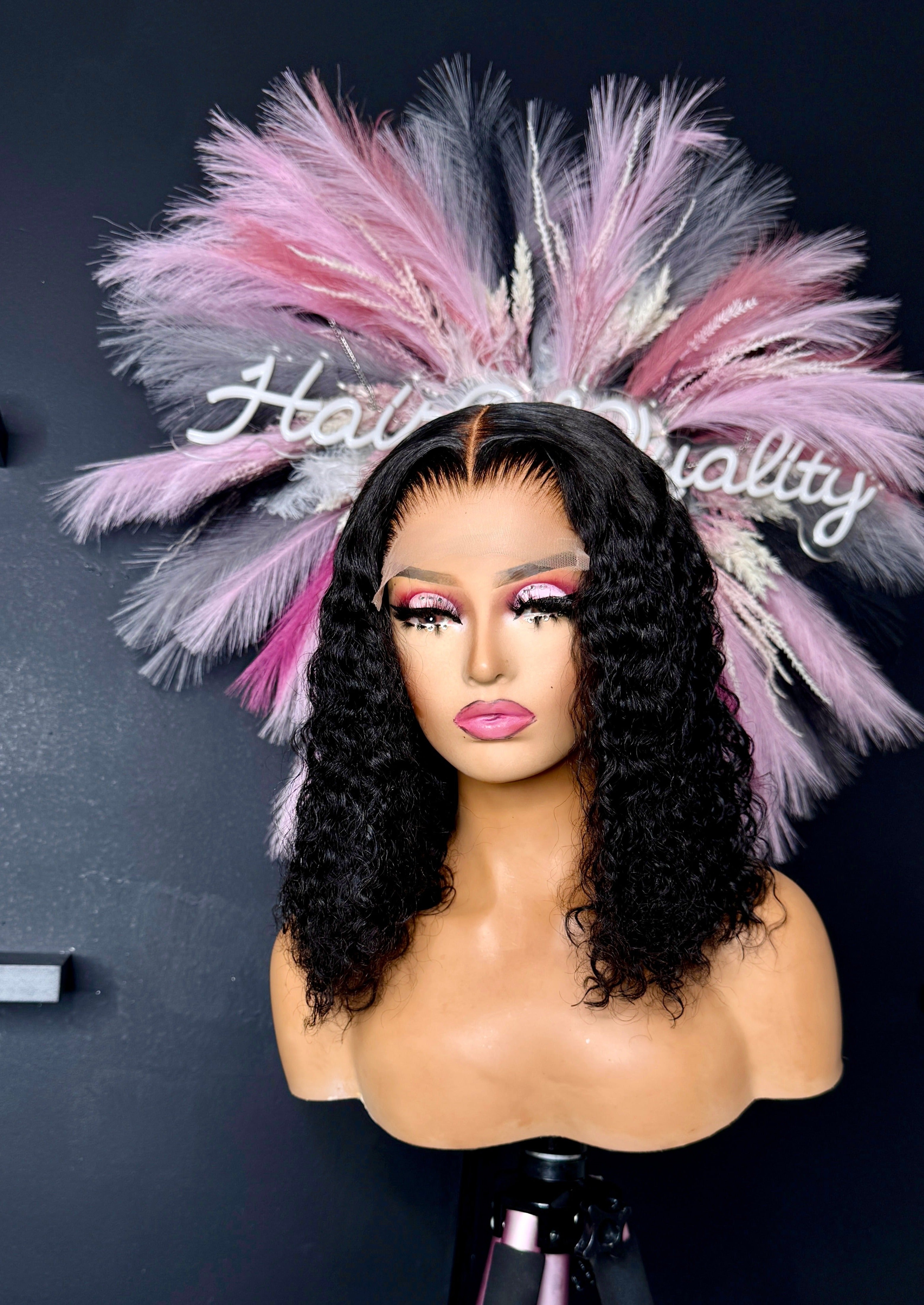 14" Loose Deep Wave wig with a 5x5 closure. This wig is styled with a middles part.